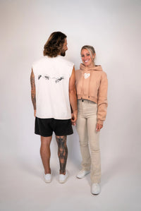 Two people standing side by side against a plain background