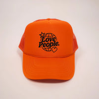 Orange cap with black text on a light gray background
