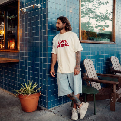 Man wearing a Love People Apparel Tee Shirt